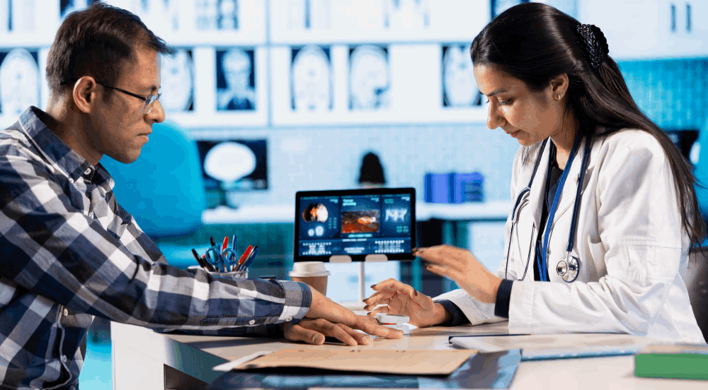 doctor consulting a patient and reviewing medical reports in a multispeciality hospital in Chennai
