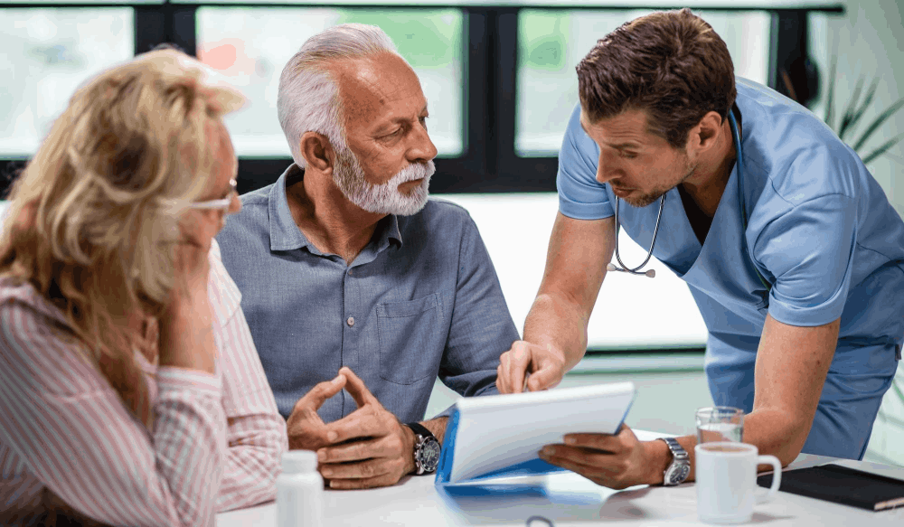 experienced doctor explaining treatment plan to elderly patients in a multispeciality hospital in Chennai